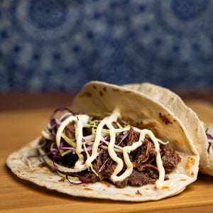 Campers Pantry freeze dried hiking food. Slow cooked beef brisket rehydrated with hot water and served here in soft tacos for a lightweight high protein hiking food.